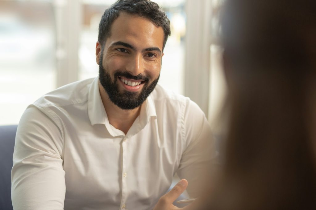 Handsome brunette male person looking at his partner